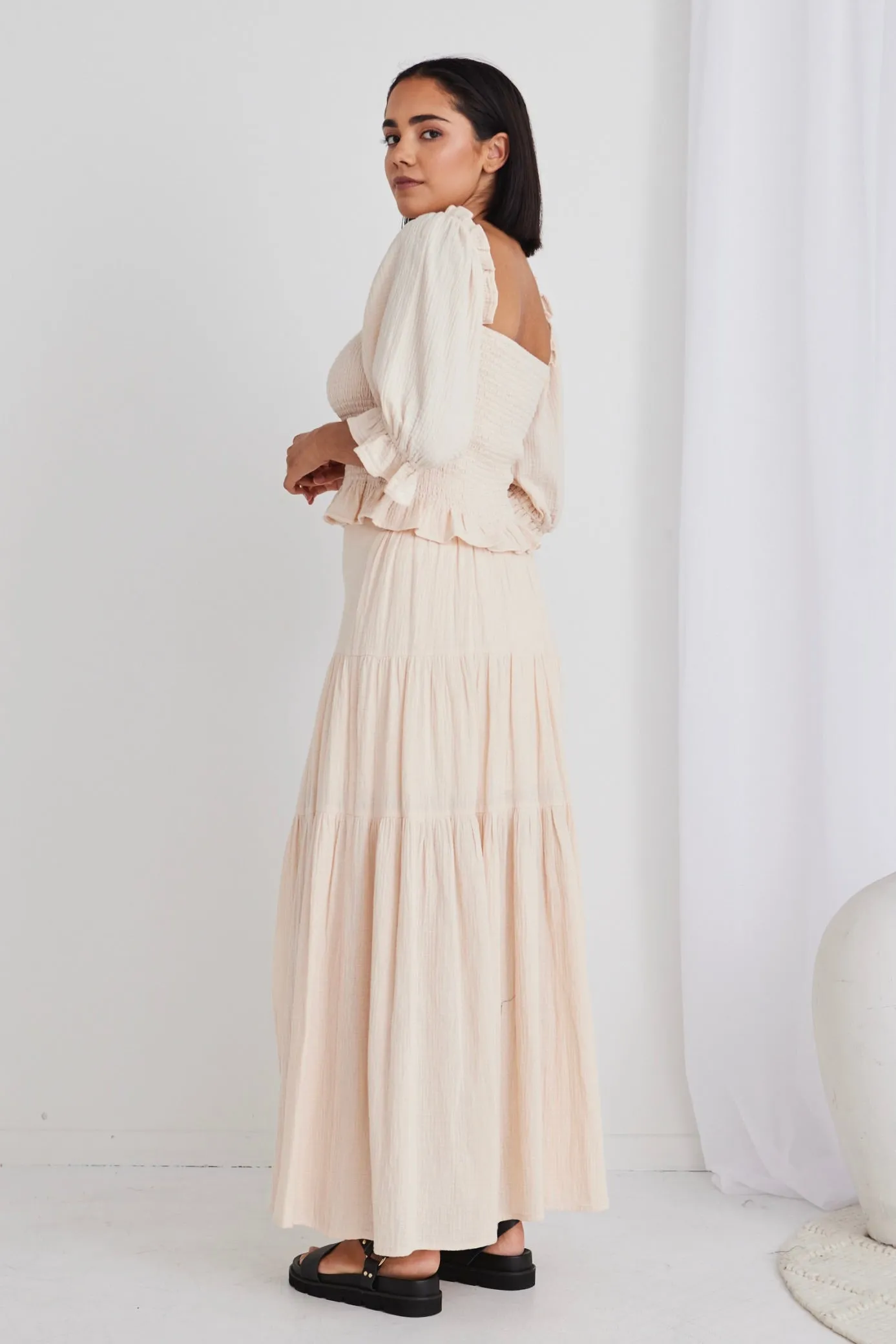 Sure, heres an optimized title with modifiers for the e-commerce product:

Chic Alive Cream Tiered Maxi Skirt with Elastic Back in Soft Muslin

This title highlights the style, color, and key features of the skirt.