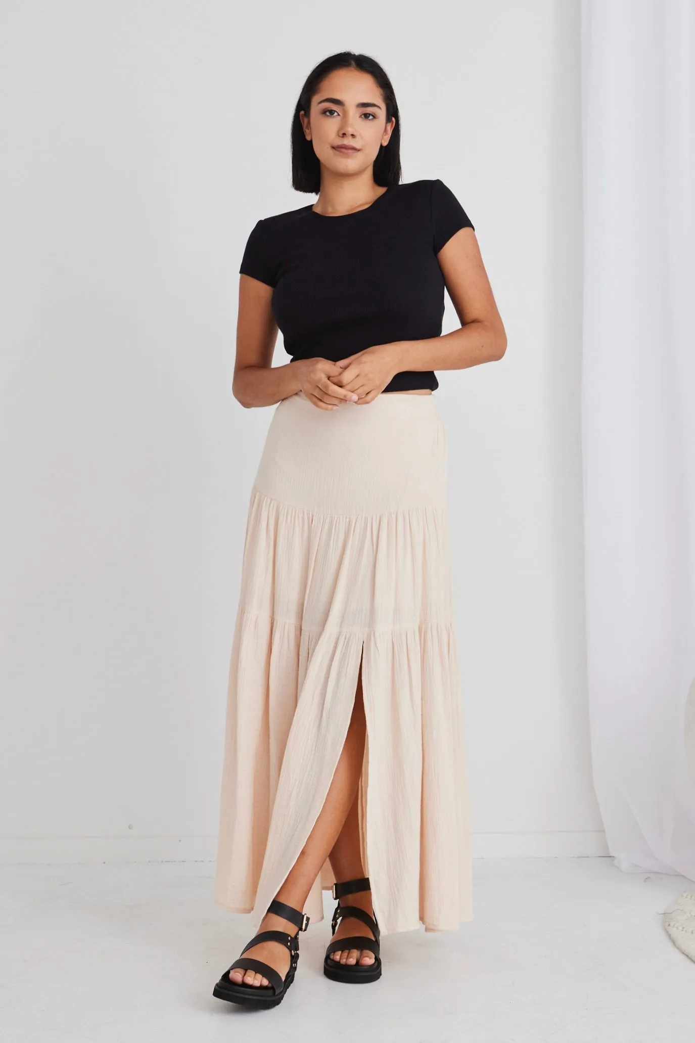 Sure, heres an optimized title with modifiers for the e-commerce product:

Chic Alive Cream Tiered Maxi Skirt with Elastic Back in Soft Muslin

This title highlights the style, color, and key features of the skirt.