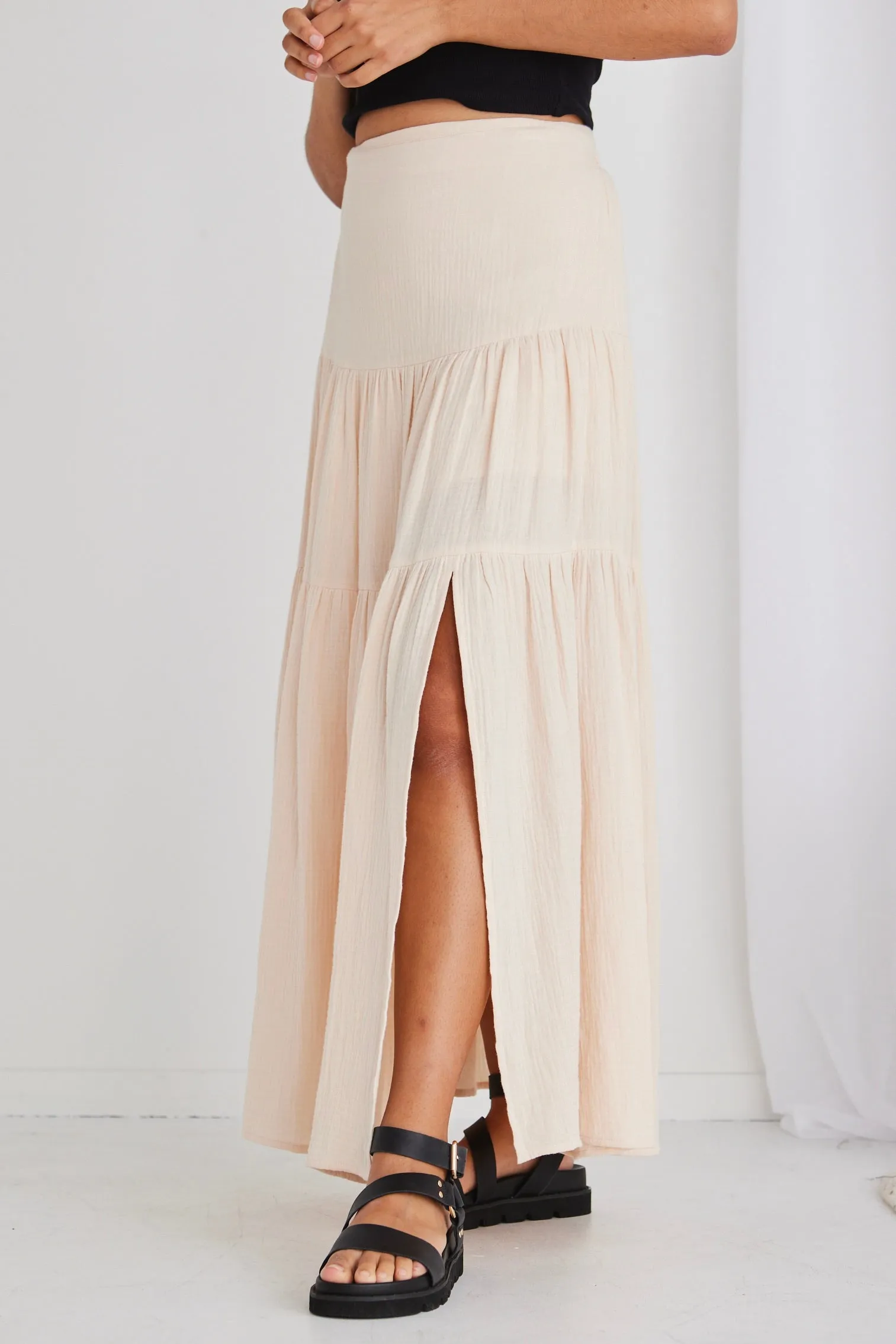 Sure, heres an optimized title with modifiers for the e-commerce product:

Chic Alive Cream Tiered Maxi Skirt with Elastic Back in Soft Muslin

This title highlights the style, color, and key features of the skirt.